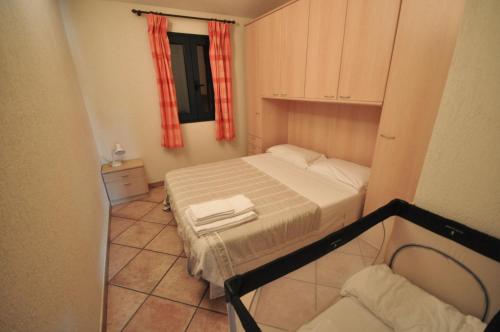 En eller flere senge i et værelse på Villette Via Carbonia