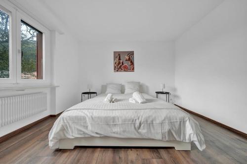 Postel nebo postele na pokoji v ubytování PEARL09 Appartement spacieux près de Bienne 2D