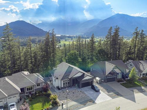 an aerial view of a house with mountains in the background at Stylish Retreat in Agassiz with Scenic Views in Agassiz