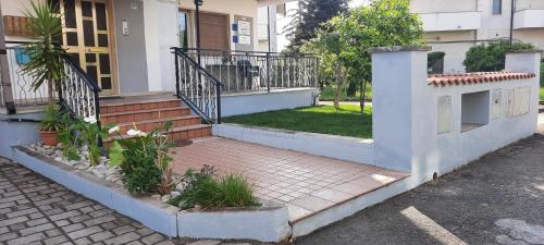 a house with stairs and plants in front of it at Casa Vacanza Nonni Di Millo in Manoppello