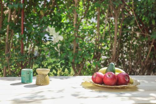 a plate of fruit sitting on a table at Holiday Apartment Fourka in Skala Fourkas