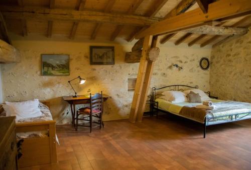 Ένα ή περισσότερα κρεβάτια σε δωμάτιο στο B&B Les Secrets de Tifayne