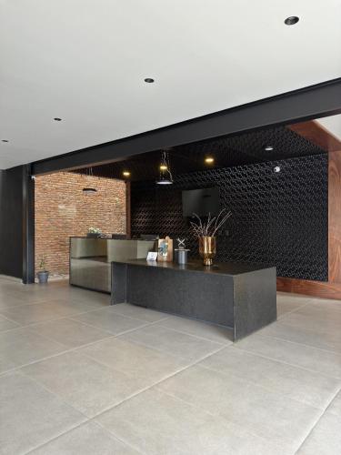 a lobby with a reception desk in a building at Esplendor by Wyndham San Luis Potosi in San Luis Potosí