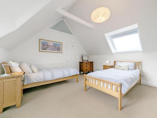 Voodi või voodid majutusasutuse Old Lock Cottage, Birdham toas