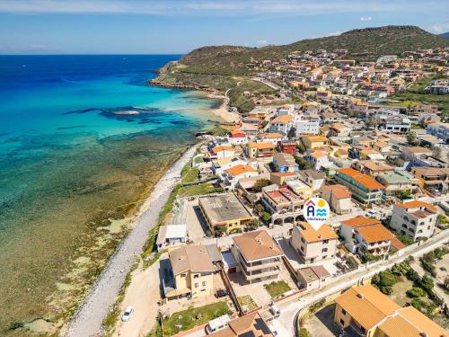 an aerial view of a town next to the ocean at AffittaSardegna - Quadri Alba in Castelsardo
