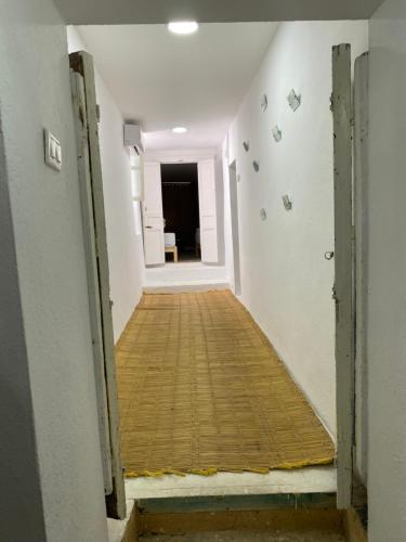 a hallway with a wooden floor in a room at Traditional Medina House - Entire Home in Tunis