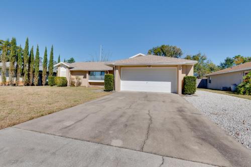 a driveway leading to a house with a garage at Day Trip to Disney Deltona Escape with Patio in Deltona