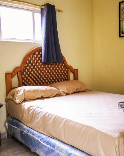 Ένα ή περισσότερα κρεβάτια σε δωμάτιο στο ESTANCIA CASA DE PIEDRA hostal