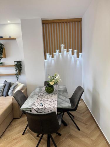 a dining room with a table and chairs and a couch at Sea & Luxury in Perea