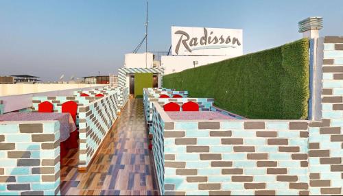 a row of seats on the side of a building at Radisson Hotel Bareilly Airport in Bareilly