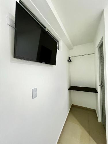 TV a/nebo společenská místnost v ubytování Hotel Paraiso Salvaje