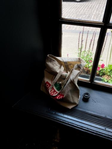 a bag sitting on a window sill next to a window at Maison Saint-Vincent By Maisons & co in Montréal