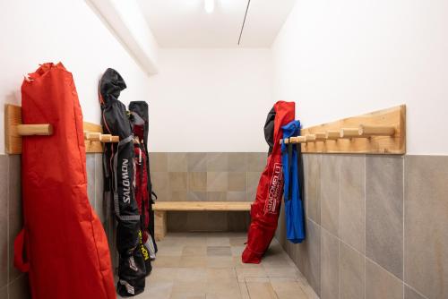 a row of umbrellas hanging on a wall at Studio Ebi Vacation - Alleghe - Monte Civetta in Alleghe
