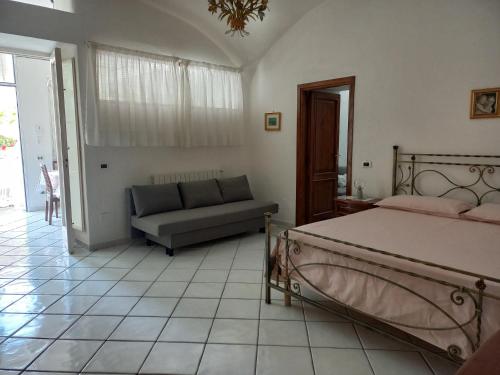 Ένα ή περισσότερα κρεβάτια σε δωμάτιο στο Casa Lucia