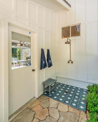 a white door with a bench next to it at Casa Miramar by Paradise Retreats in Montecito