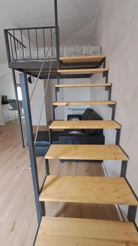 a staircase with a bunk bed in a room at Alfaro54 in Brunate
