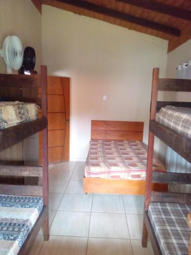 Postel nebo postele na pokoji v ubytování casa temporada capitólio