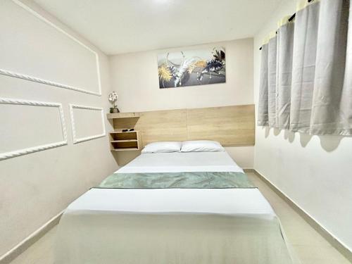 Postel nebo postele na pokoji v ubytování Hotel GRAND H RODADERO