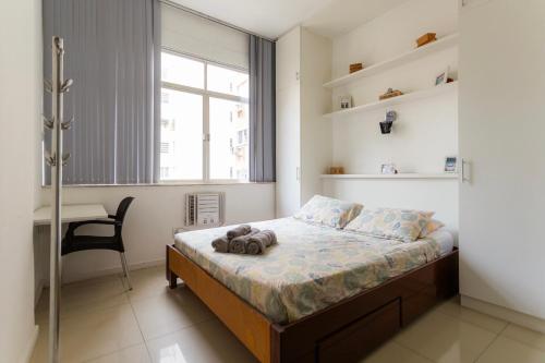 Giường trong phòng chung tại SUH Copacabana 36 Confort Sun