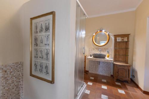 a bathroom with a sink and a mirror at Il Casale Di Villa Rossi in Lucca