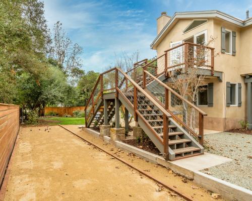 a wooden staircase leading up to a house at Montecito SeaRenity by Paradise Retreats in Montecito
