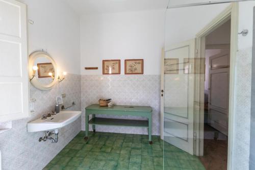 a bathroom with a sink and a bathtub and a sink at Il Casale Di Villa Rossi in Lucca
