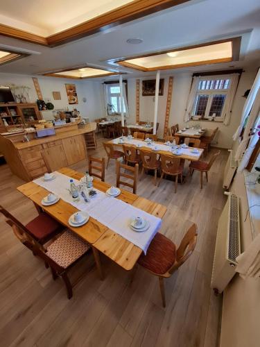 an overhead view of a restaurant with tables and chairs at Landhotel Solmser Hof GbR in Echzell