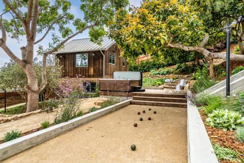 a backyard with a game of billiards at Ocean View House and Loft in Summerland