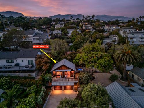 an aerial view of a house with a sign on it at Ocean View Loft by Paradise Retreats in Summerland