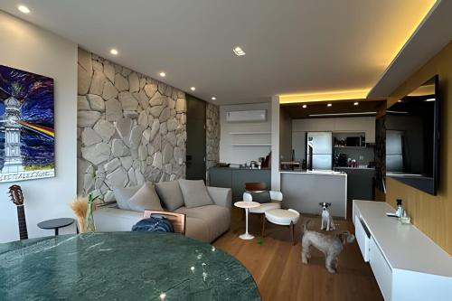 a living room with a couch and a table at Ed. Juan Miró in Curro Velho