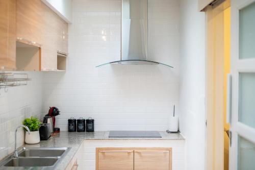 a kitchen with a sink and a stove at Happiness Pool villa Phuket Patong 154 in Patong Beach