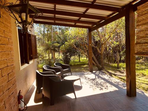 a group of chairs sitting on a patio at Casa rural in Rivera