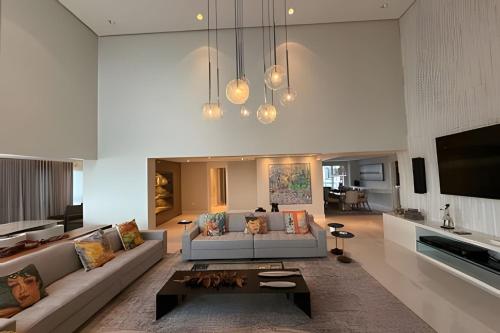 a living room with a couch and a table at Ed. Premium in Curro Velho