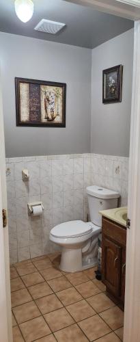 a bathroom with a toilet and a sink at Happiness queen room 3 in Newark