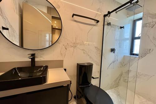 a bathroom with a sink and a shower at Ed. Piazza San Pietro in Curro Velho