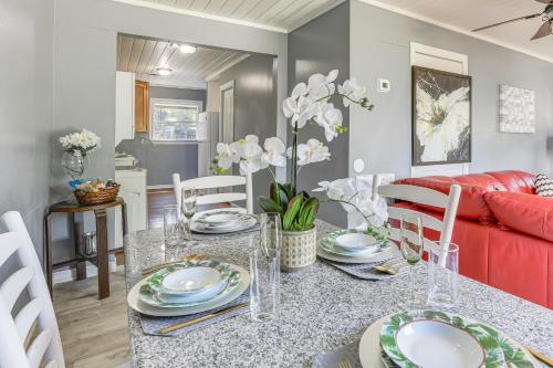a dining room and living room with a table and chairs at 12 Mi to Lake Access Port Arthur Apt with Yard in Port Arthur