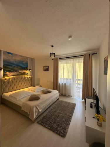 Φωτογραφία από το άλμπουμ του Căsuța de lângă izvor σε Moieciu de Sus