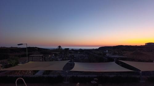 a sunset over a skate park with a skateboard ramp at Suêrte cyprus in Akanthou