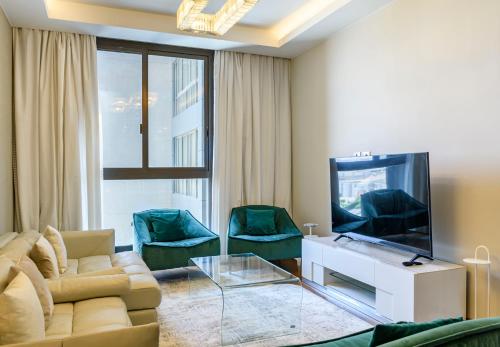 TV a/nebo společenská místnost v ubytování VESTA - El Sheikh Zayed Residence