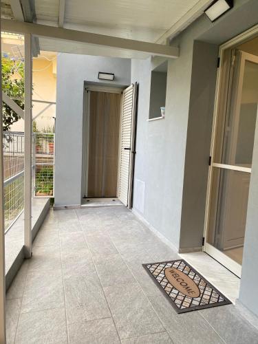 a hallway of a house with a door and a tile floor at Family house near Lefkada in Vonitsa