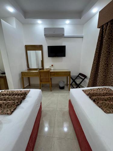 Katil atau katil-katil dalam bilik di Petra Rocks Hotel