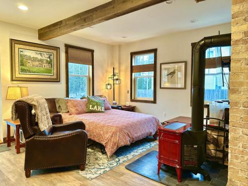a bedroom with a bed and a fireplace at Be Still & Know, Fireplace, Firetable, Walk to Port in Port Washington