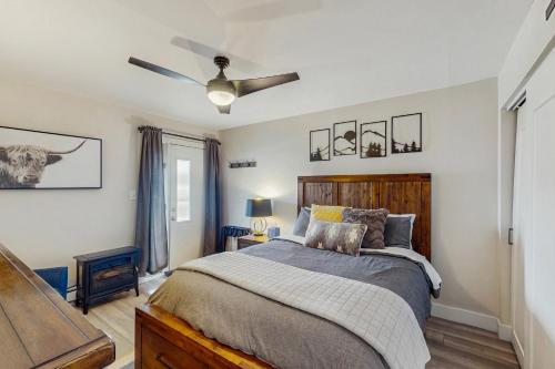 a bedroom with a bed and a ceiling fan at Winter Park Lodge II #104 in Fraser