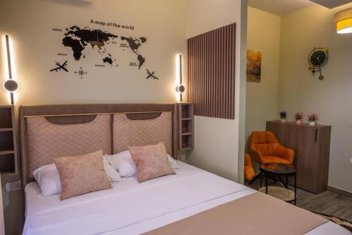 a bedroom with a bed and a desk and a chair at Hana Apartments in Ulcinj