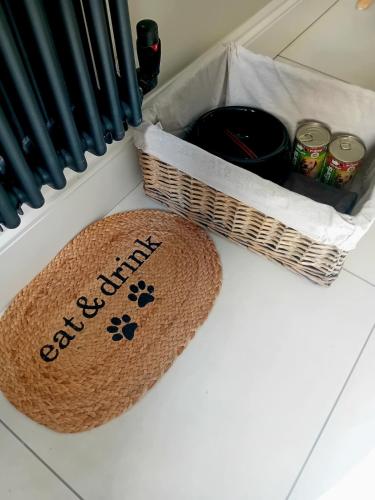 a rug and a basket on a counter with a dogmat at The Salt House in Amble