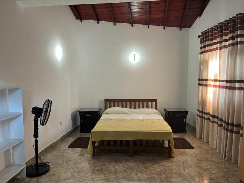 a bedroom with a bed in a room at Colombo Green Heaven in Cotta Road Railroad Station