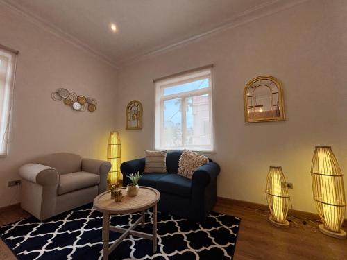 a living room with a couch and a table at Sori Apartments in Lima