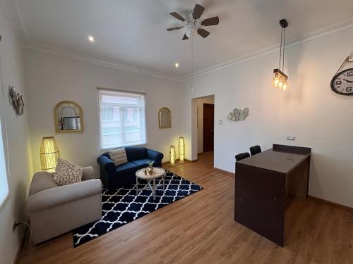 a living room with a couch and a table at Sori Apartments in Lima