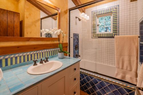 a bathroom with a sink and a mirror at Sea Ranch by Paradise Retreats in Montecito