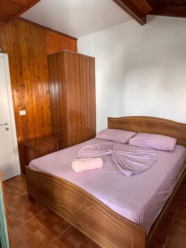a bedroom with a bed with two towels on it at Sea flavor in Shëngjin